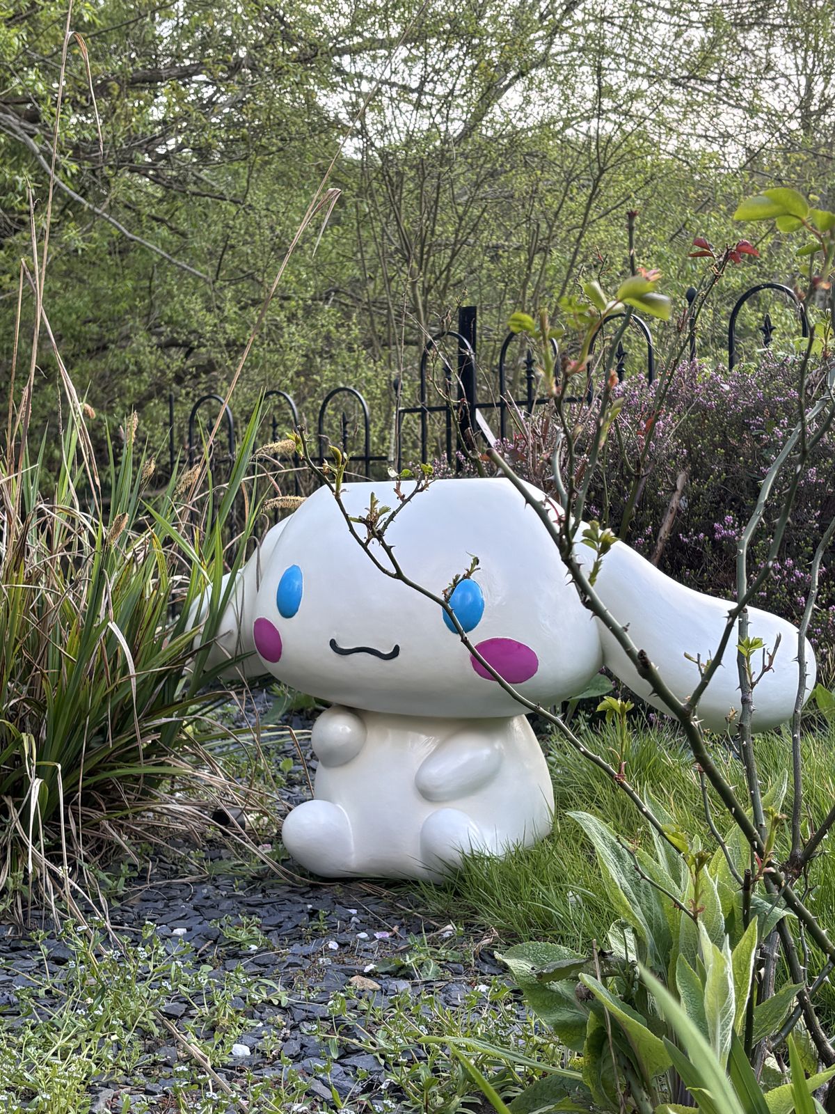 Cinnamoroll sculpture nestled in garden